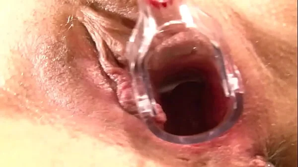 Cougar plays with ladle and speculum